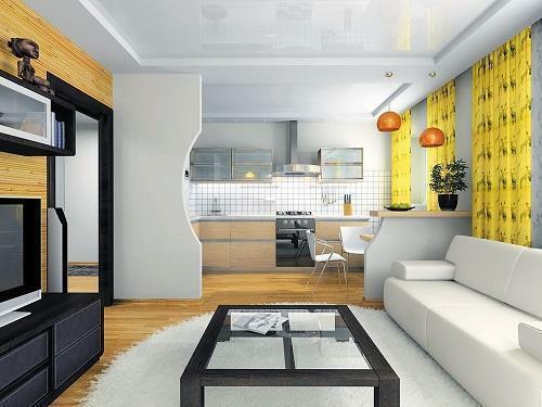 Spojením kuchyne a obývacia izba sa vykonáva pomocou architektonických prvkov, ktoré rozdeľujú priestor do funkčných oblastí