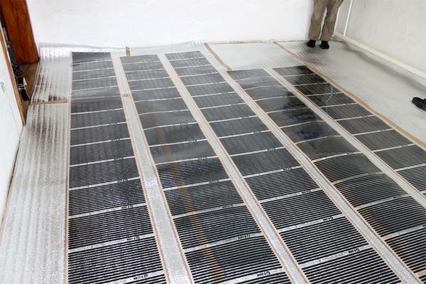 Lay the infrared film warm floor under the linoleum - it is at least economically justified