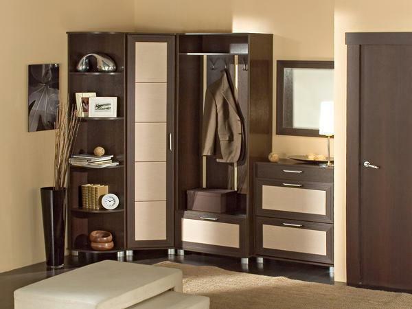 It is worth choosing such a corner cabinet in the hallway, which will accommodate the things of all family members