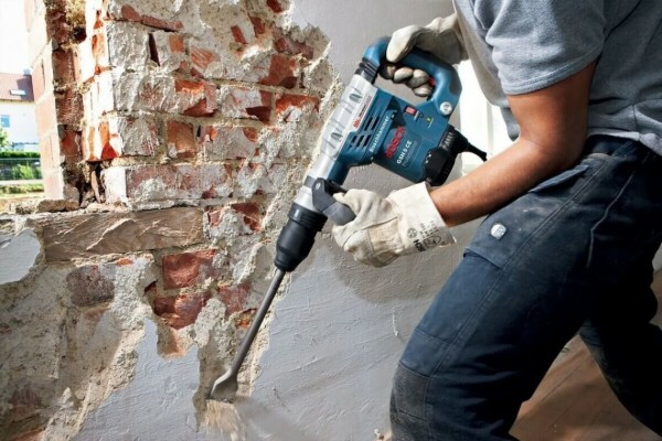 Removing old plaster hammer