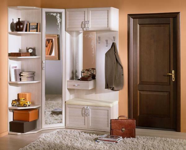 An excellent solution is the location of furniture in the hallway to the right or left of the entrance door
