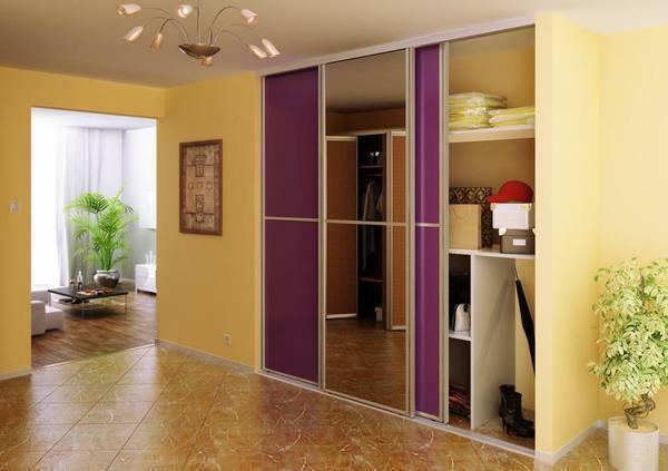 Visually enlarge the small entrance hall in the apartment is possible using a stylish closet with mirrored doors