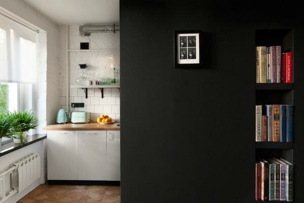 Part of the kitchen is hidden behind a black wall